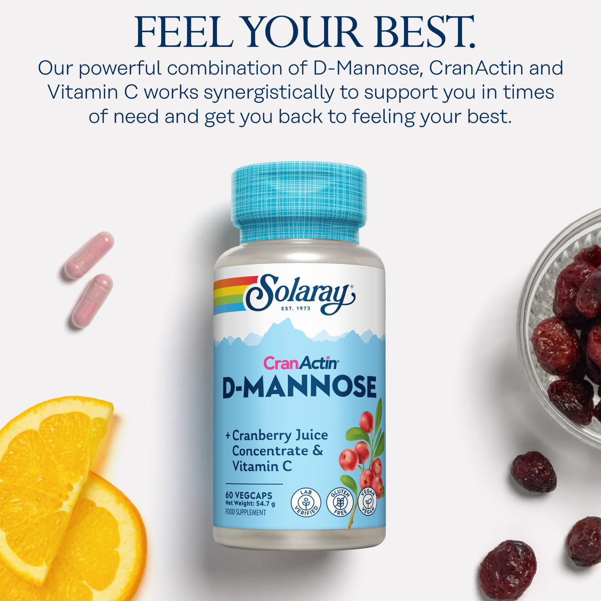 Solaray D-Mannose Cranberry capsules with orange slices on a white background.