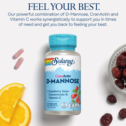 Solaray D-Mannose Cranberry capsules with orange slices on a white background.